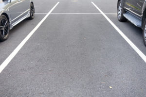 space between cars in parking lot