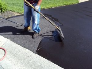 Asphalt sealcoating