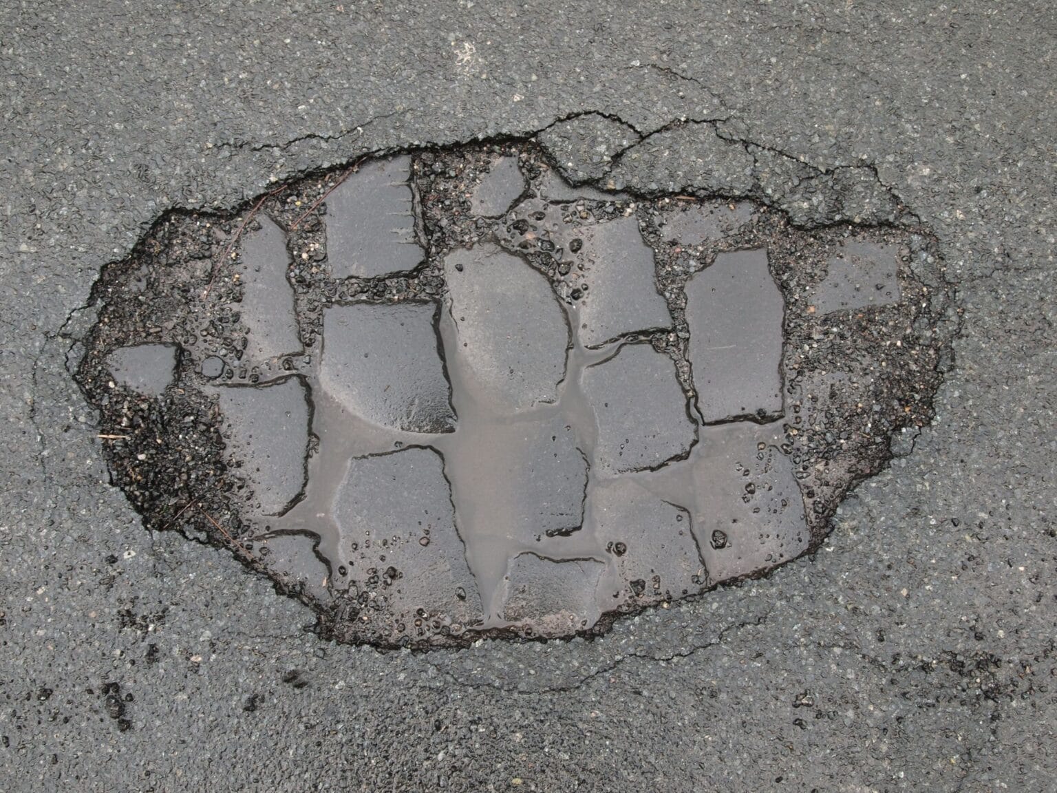 What Causes Potholes on Commercial Asphalt Parking Lots Pothole Repair
