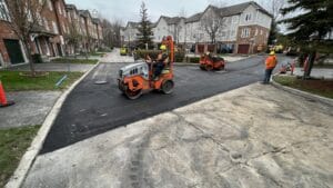 Asphalt being compacted