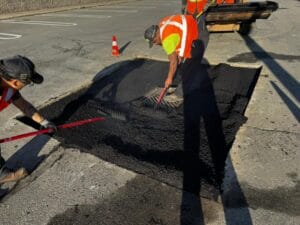 Asphalt is laid and raked