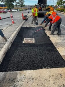 Hot asphalt is levelled